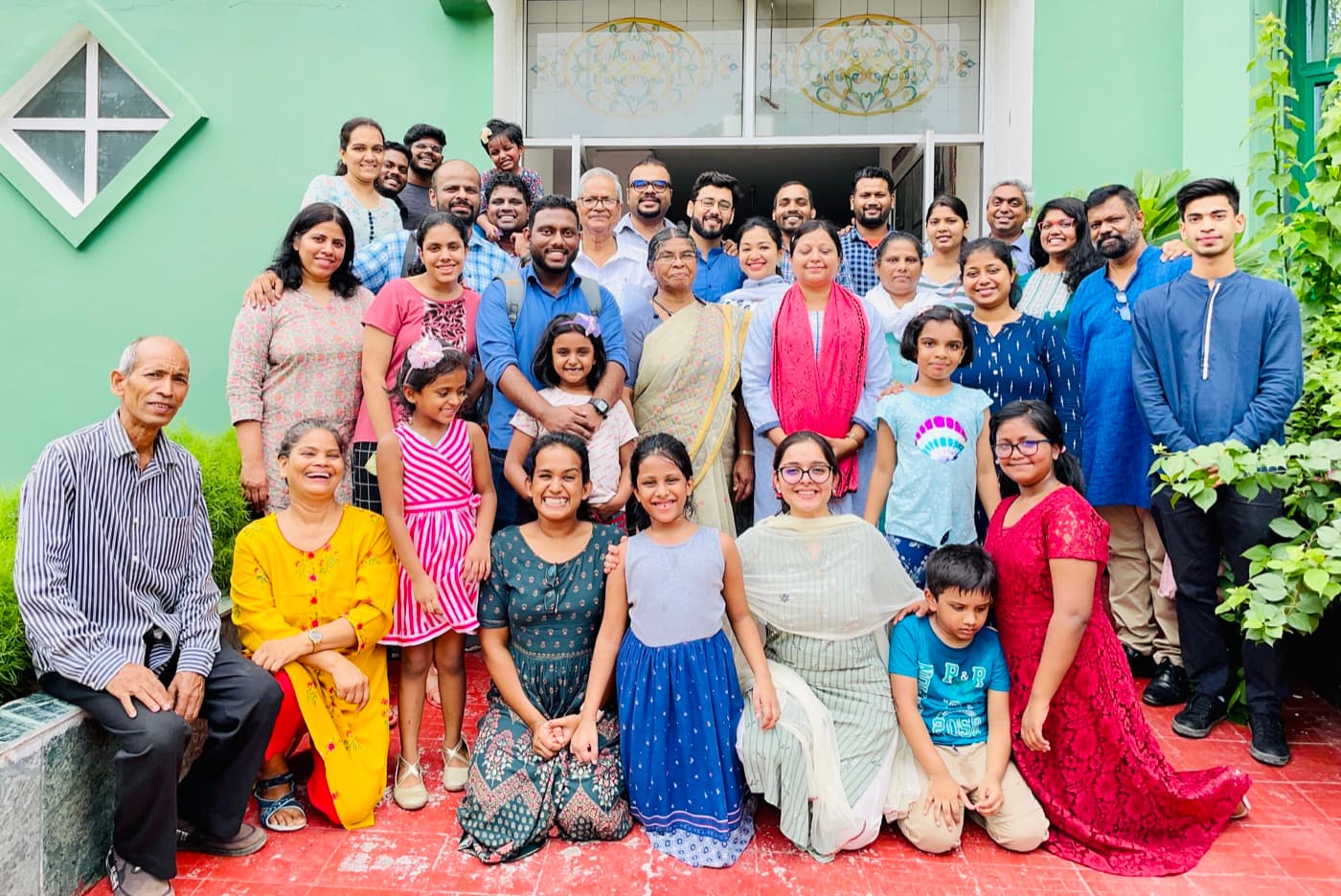 CBF Dwarka church family gathered outside a church building